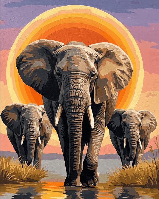 Three elephants walking together with a colorful sunset in the background.